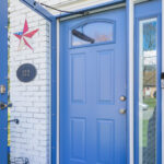 A blue door with a star on it.
