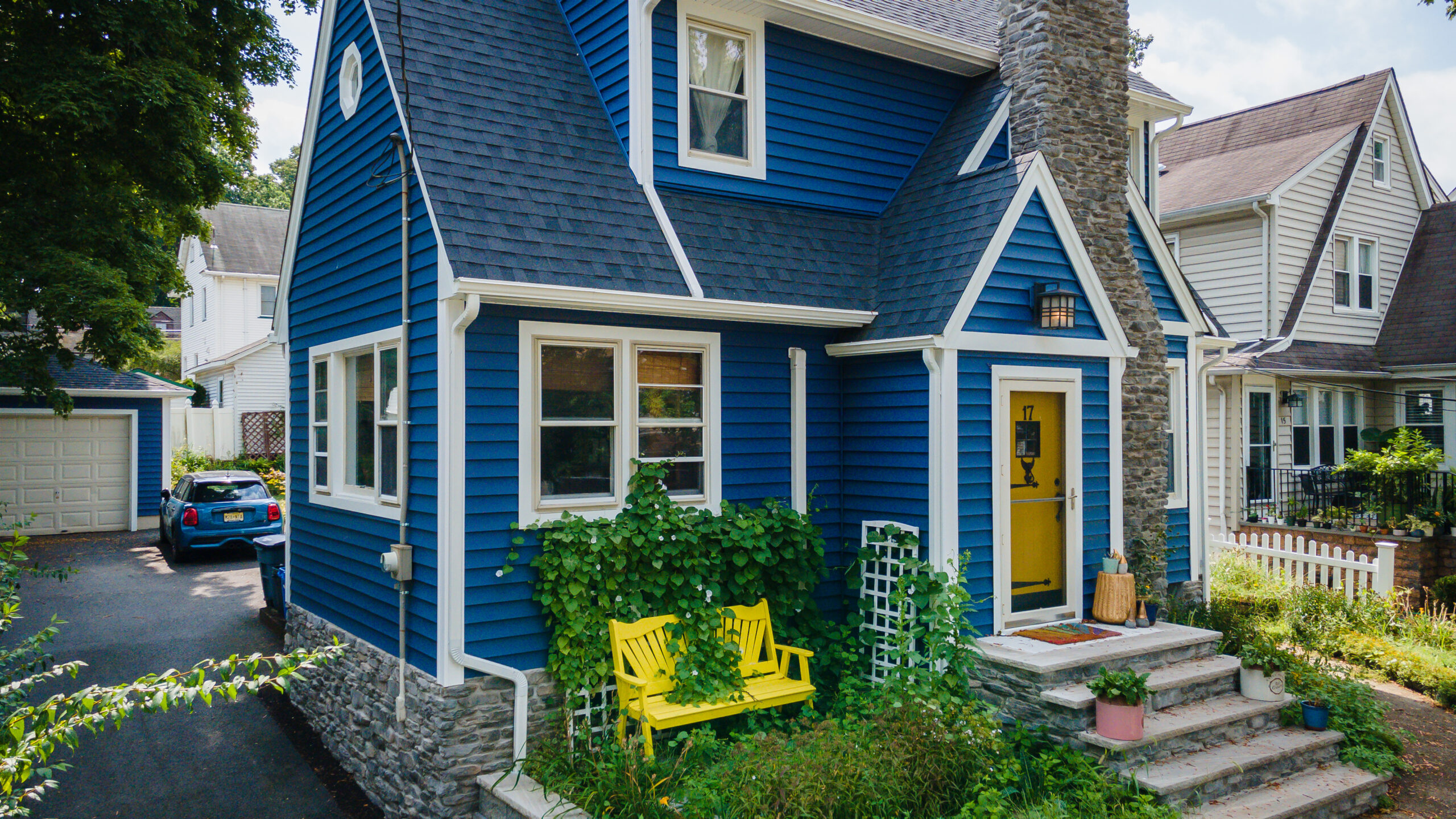 A blue house with a yellow door.