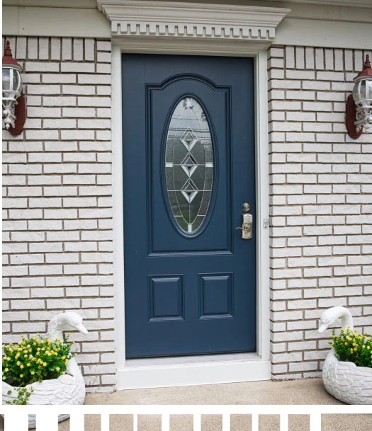 A blue front door with a flower pot on it.