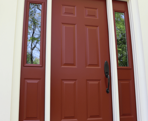 Enhance your home's curb appeal with a bold red entry door, surrounded by clean, white trim, reflecting a welcoming and stylish exterior makeover.